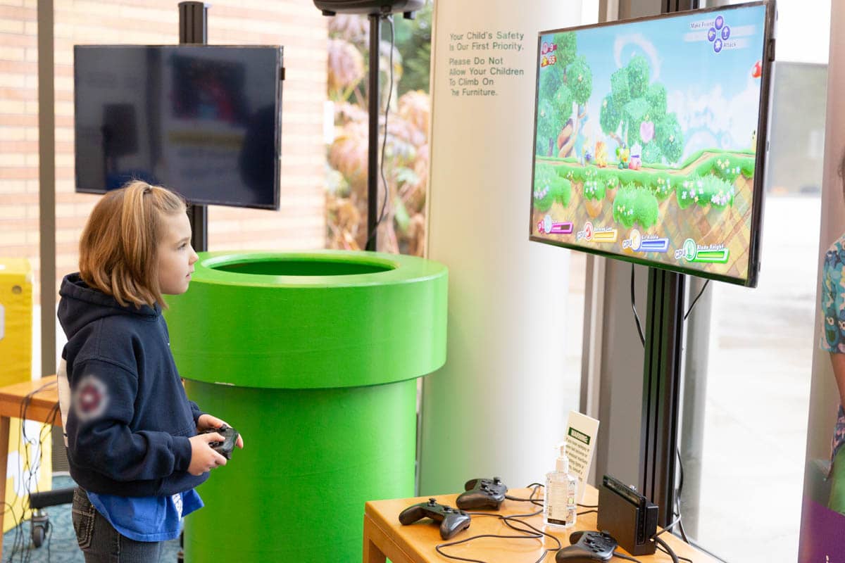 Juliet, a patient at Mary Bridge Children’s Hospital plays the Starlight Nintendo Switch gaming station.